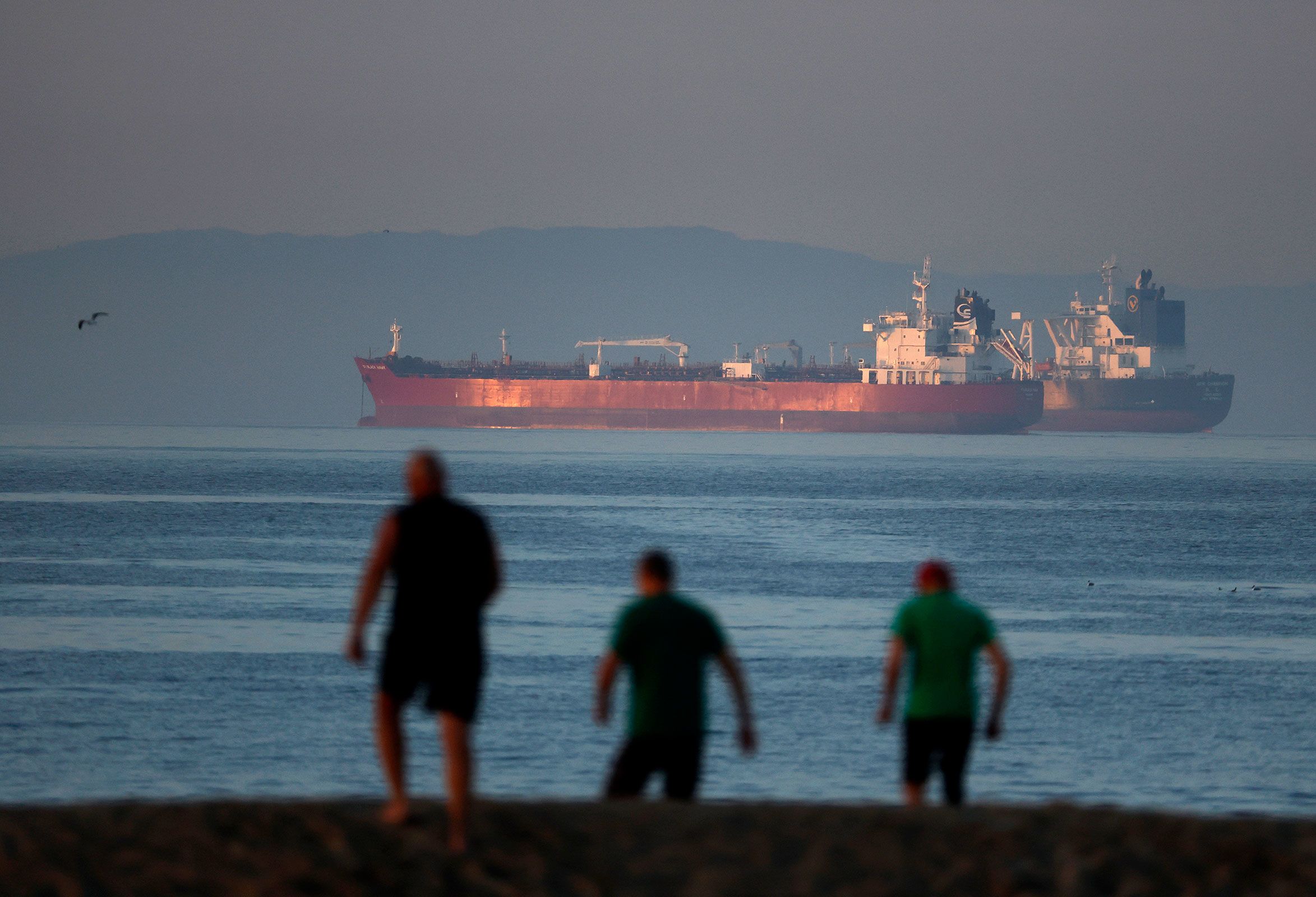 <i>Justin Sullivan/Getty Images via CNN Newsource</i><br/>Oil tankers sit anchored off the coast of Seal Beach in California
