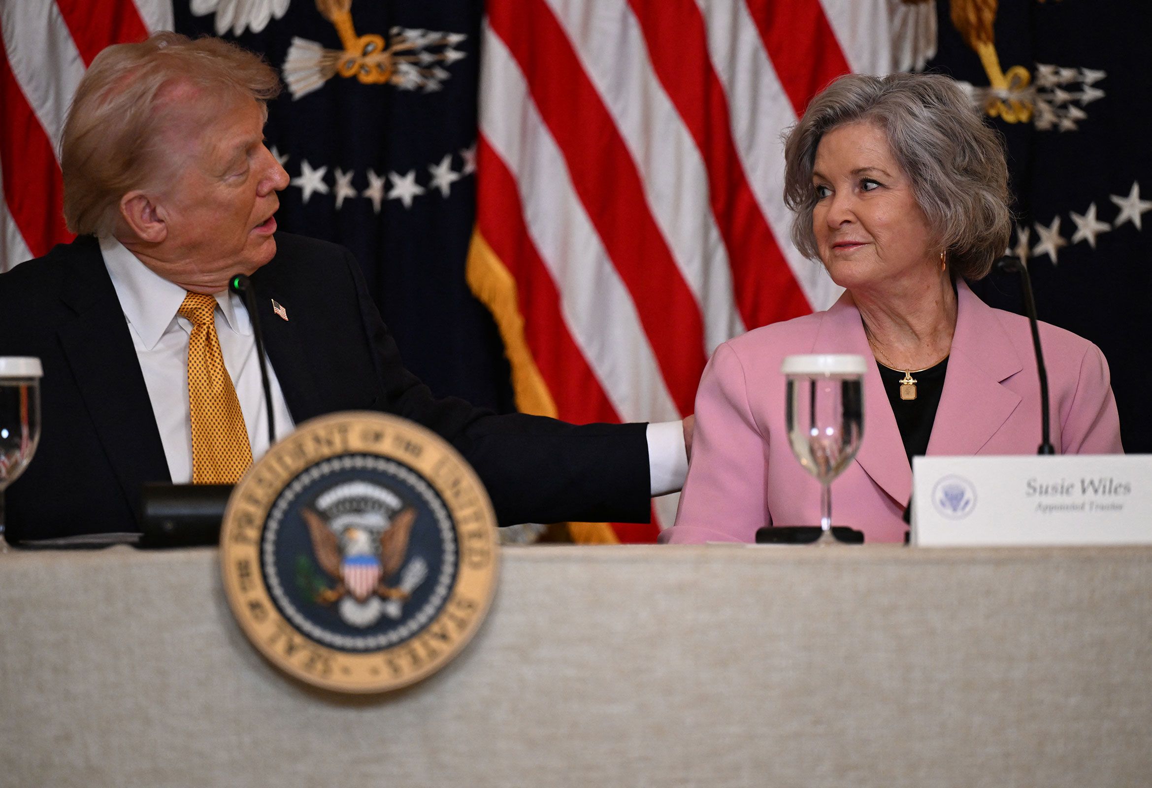 <i>Annabelle Gordon/AFP/Getty Images via CNN Newsource</i><br/>President Donald Trump speaks with Susie Wiles during a Kennedy Center board meeting at the White House on March 16