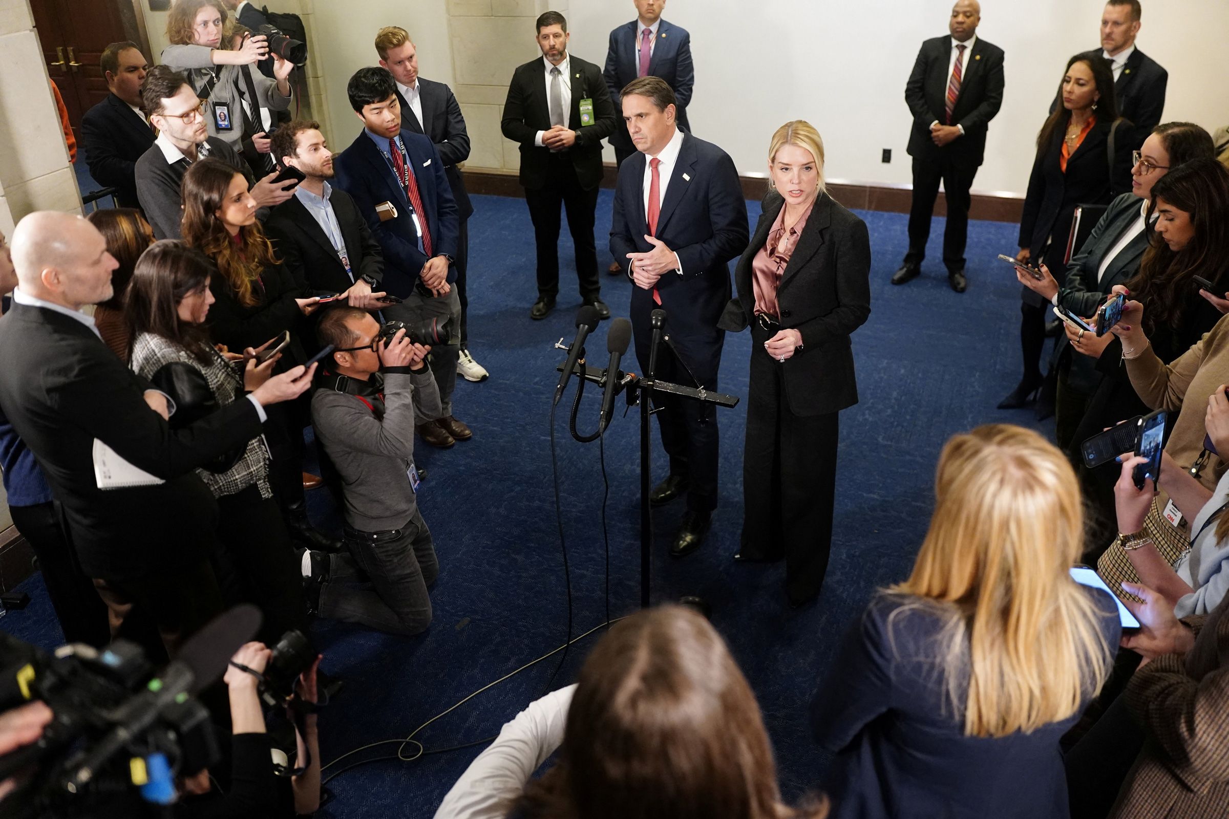 <i>Nathan Howard/Reuters via CNN Newsource</i><br/>Attorney General Pam Bondi and Deputy Attorney General Todd Blanche speak to the media following a closed-door briefing on Capitol Hill in Washington