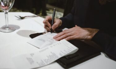 Among the criteria determining whether you may deduct some of your tip income is that the tips must be voluntary