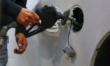 A driver fills their gas tank with fuel at an Exxon gas station in Houston on March 19.