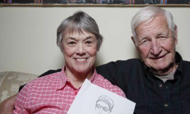 Sarah Davidon looks through documents her father