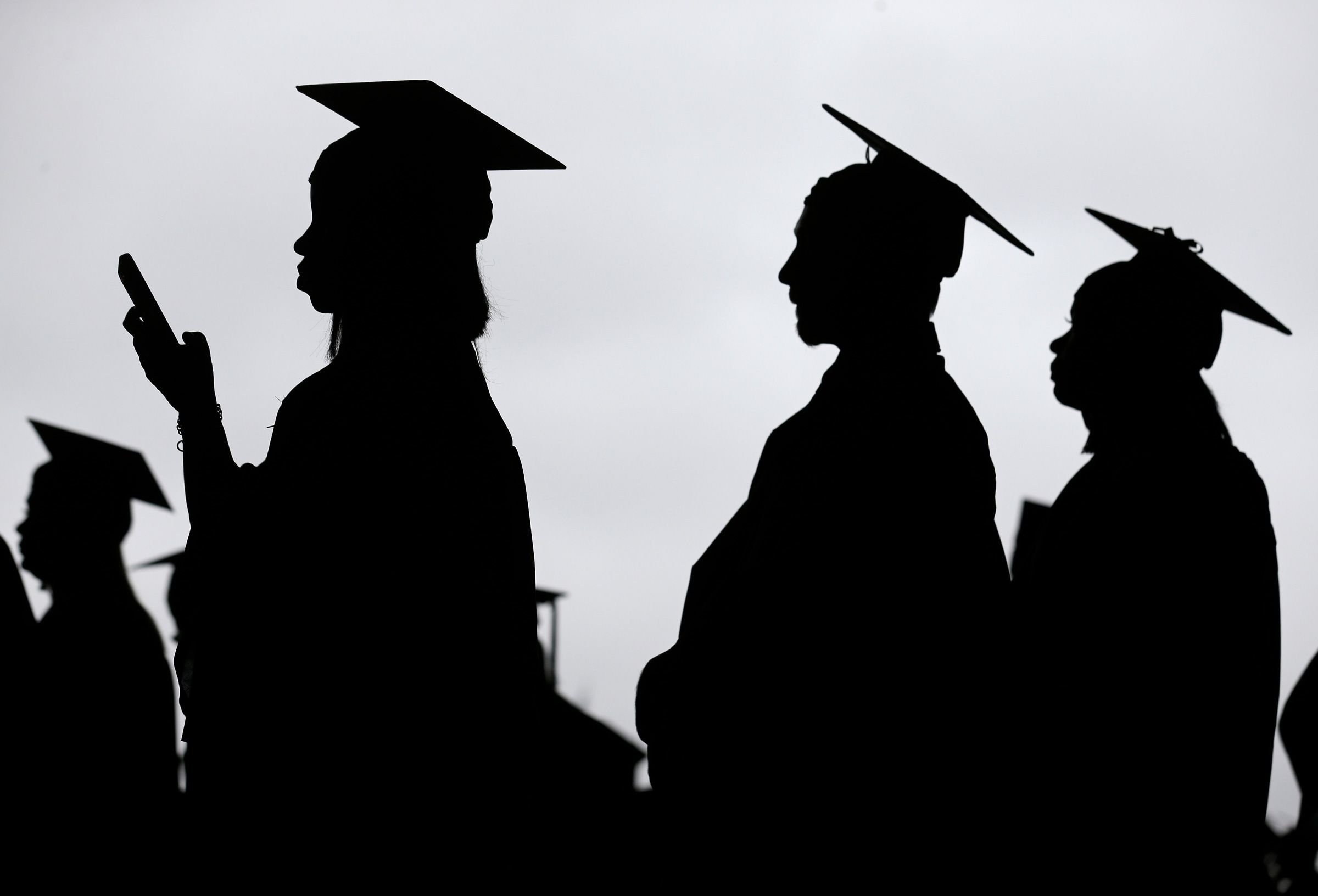 <i>Seth Wenig/AP/File via CNN Newsource</i><br/>Graduates line up before the start of the Bergen Community College commencement at MetLife Stadium in East Rutherford