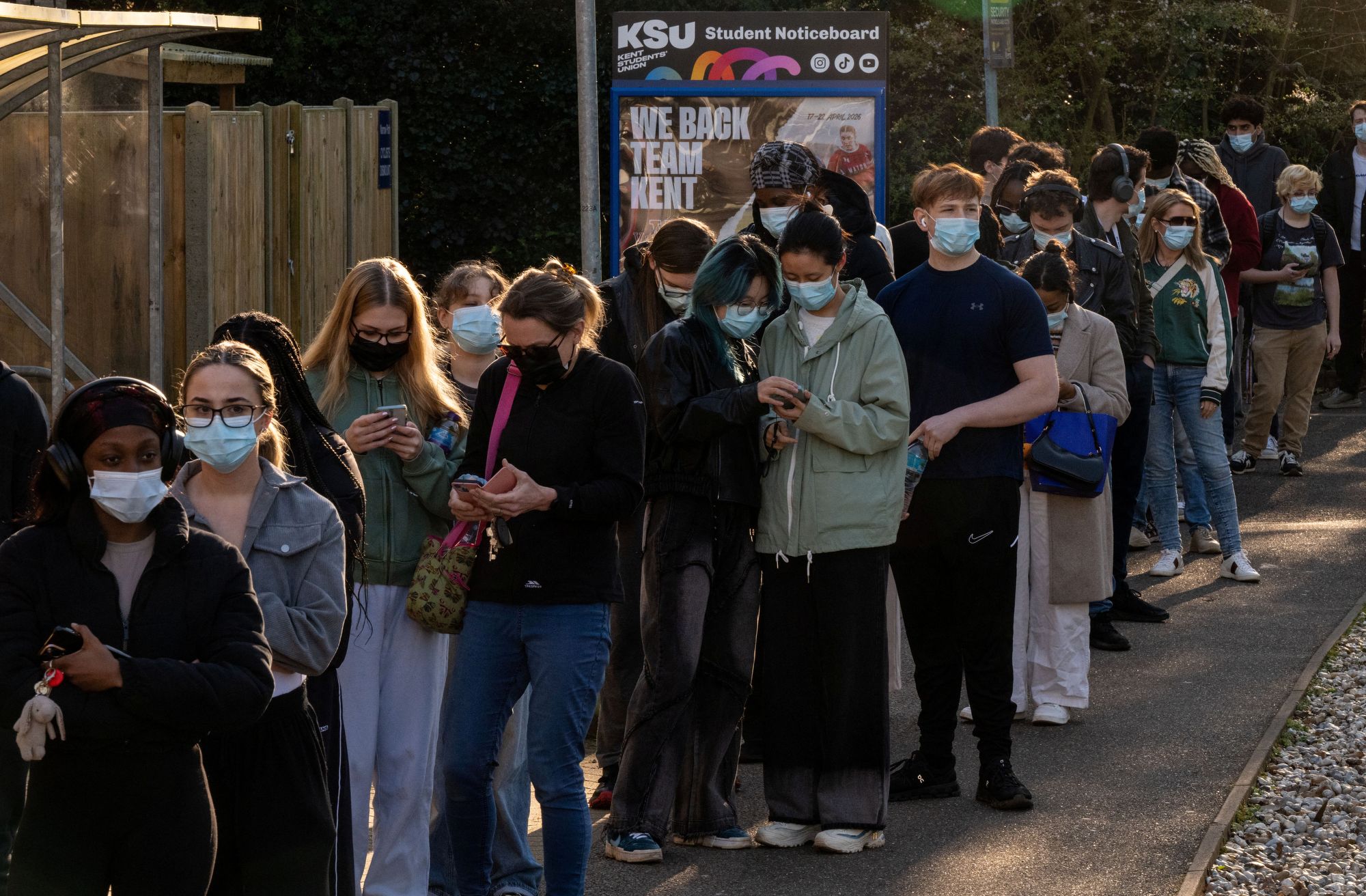 <i>Chris J Ratcliffe/Reuters via CNN Newsource</i><br/>People queue to receive vaccinations on the University of Kent campus