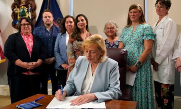 Graham Platner greets audience members at a campaign town hall meeting in Ogunquit
