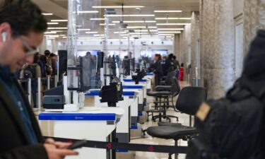 TSA counters sit empty as passengers wait in long security lines at Hartsfield-Jackson Atlanta International Airport on March 20.