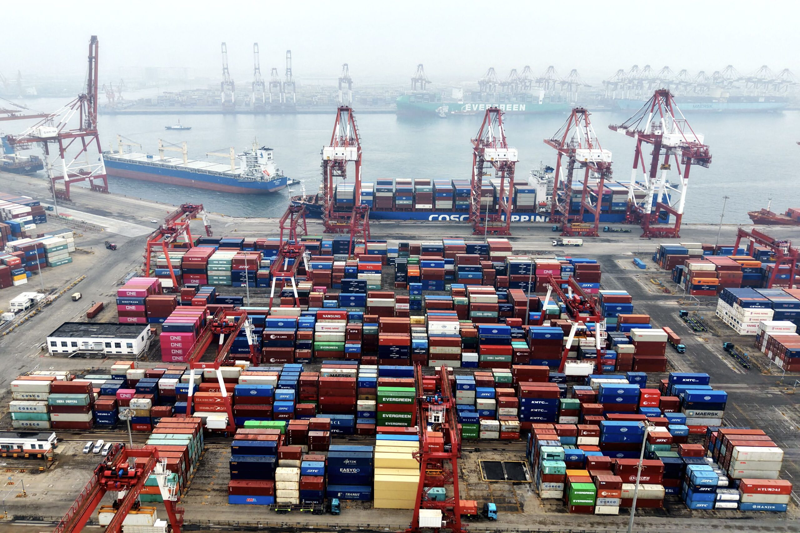 <i>AFP/Getty Images via CNN Newsource</i><br/>Cargo containers and ships are seen at a port in Qingdao