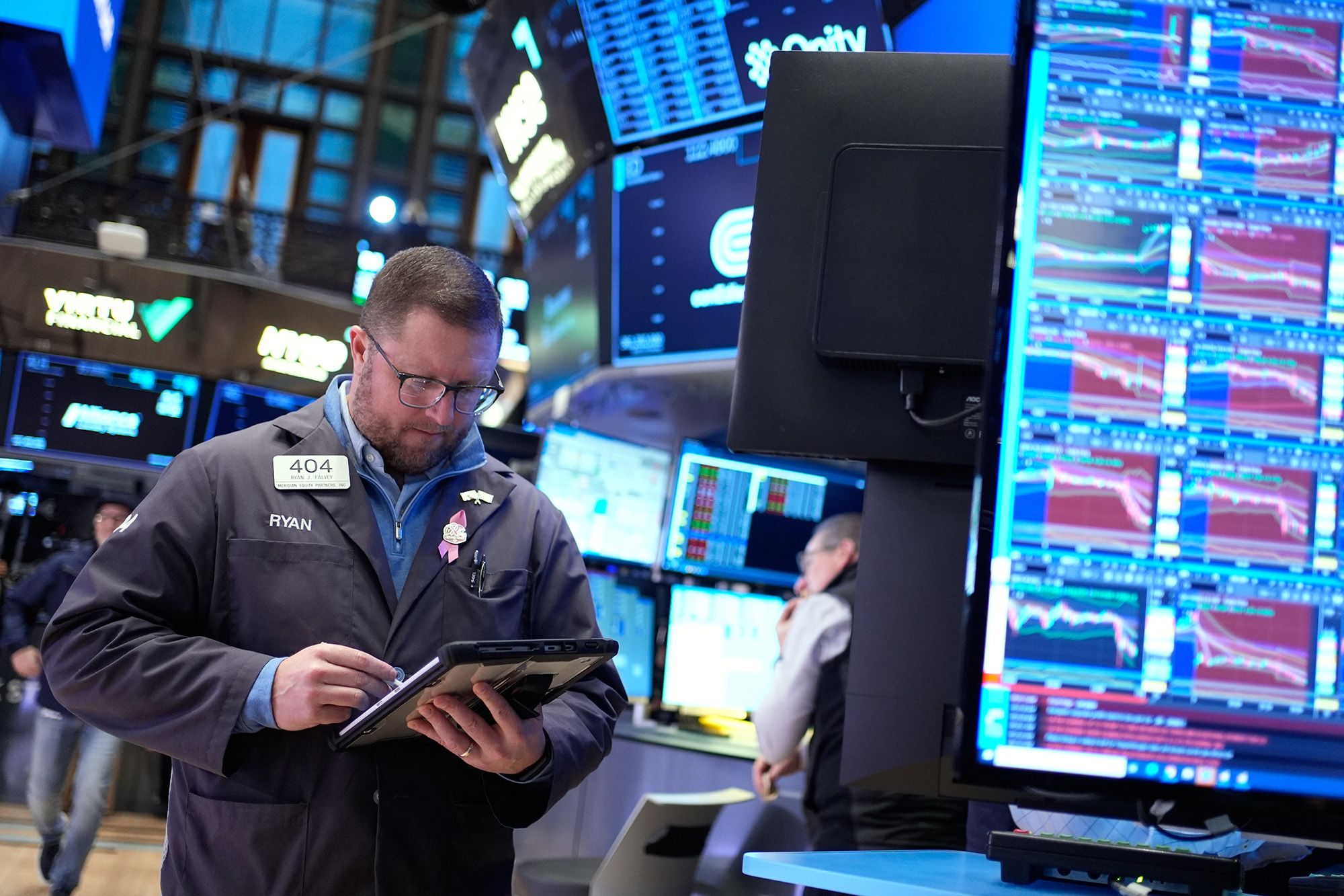 <i>Seth Wenig/AP via CNN Newsource</i><br/>Ryan Falvey works on the floor at the New York Stock Exchange in New York