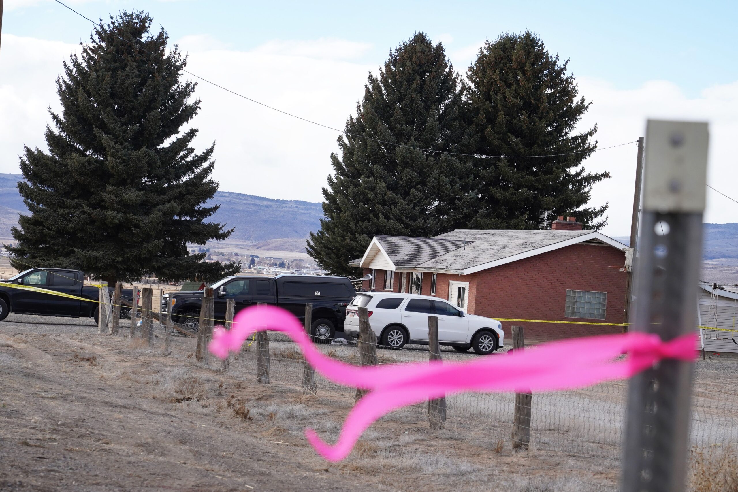 <i>George Frey/AP via CNN Newsource</i><br/>A pink ribbon hangs March 5 on a pole in front of the house where a woman was killed in Lyman