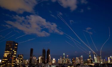 This long-exposure photo shows flare trails of the interceptor missiles launched from Israeli air defense systems in Tel Aviv