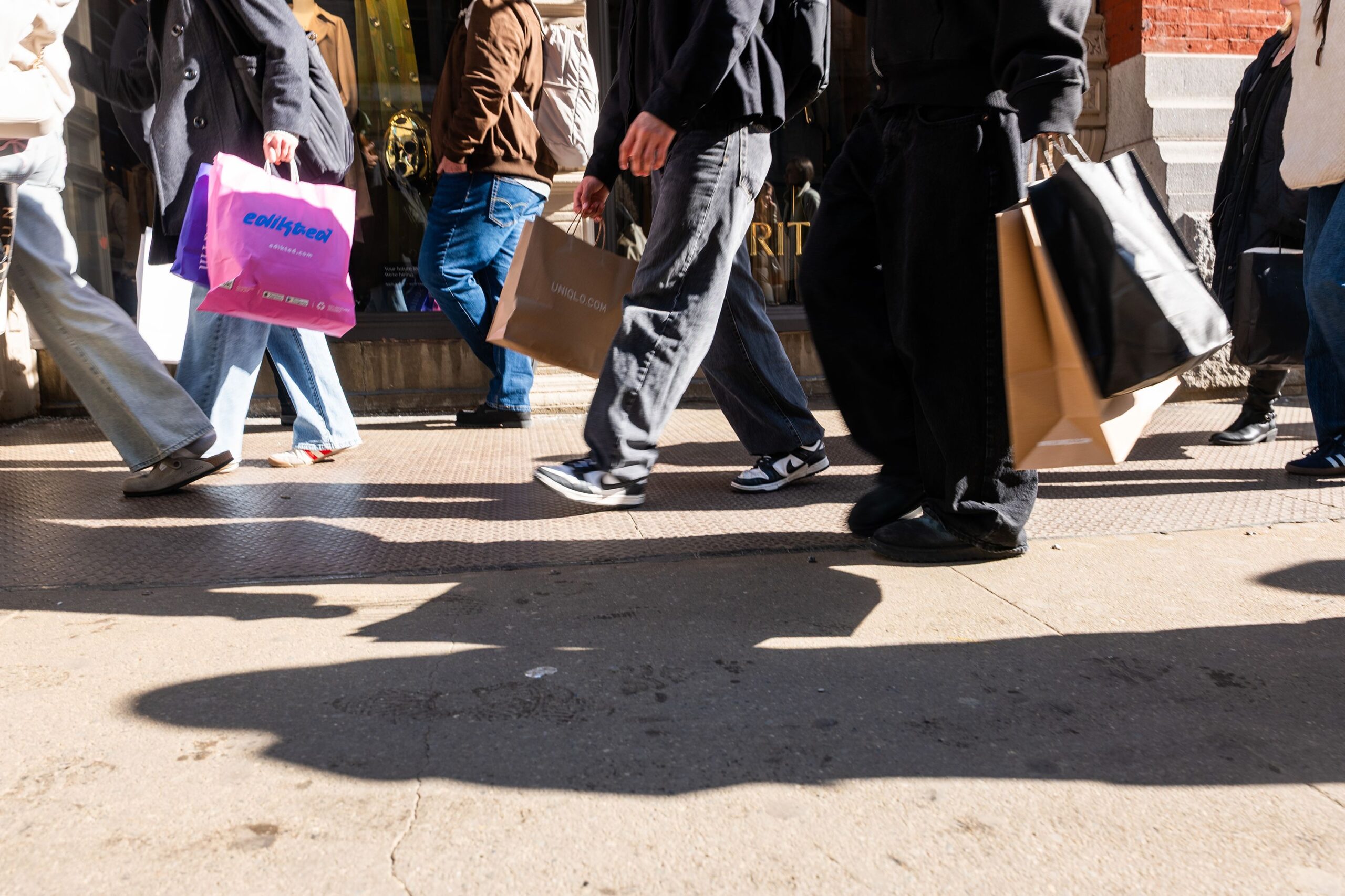 <i>Spencer Platt/Getty Images via CNN Newsource</i><br/>People walk along Broadway with shopping bags on February 27
