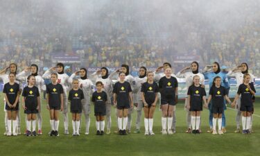 Iran's players salute and sing the national anthem before a group stage match against Australia at the 2026 AFC Women's Asian Cup in the Gold Coast on March 5.