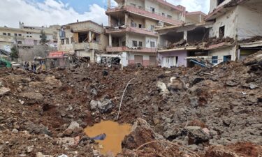 A huge crater left by an Israeli airstrike in the village of Nabi Chit
