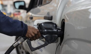A man pumps gasoline into his vehicle at a gas station in New York City on March 4
