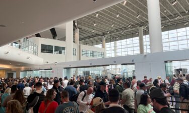 Passengers gather at Louis Armstrong New Orleans International Airport