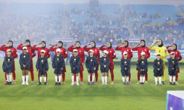 The Iranian players salute the national anthem before the Women's Asian Cup match with the Philippines at Gold Coast Stadium on March 08 2026.