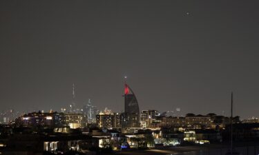 A projectile (Top-R) streaks accross the sky over Dubai on March 5. Airports