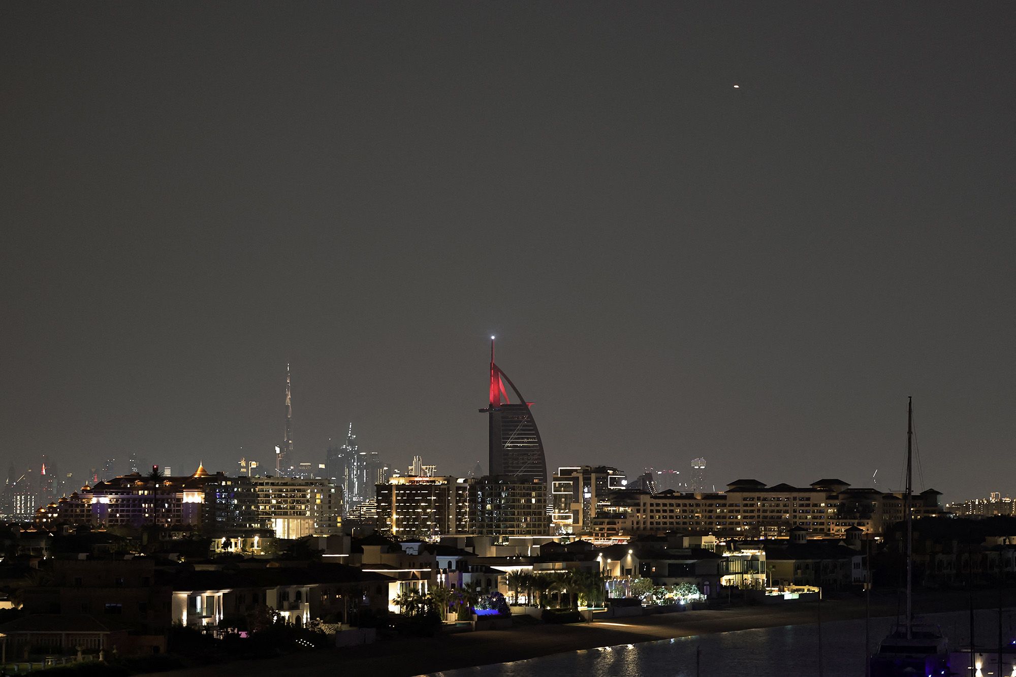 <i>Fadel Senna/AFP/Getty Images via CNN Newsource</i><br/>A projectile (Top-R) streaks accross the sky over Dubai on March 5. Airports