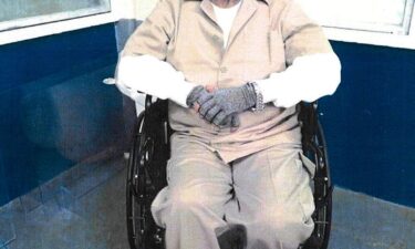 Charles Burton is seen with his mother and daughter