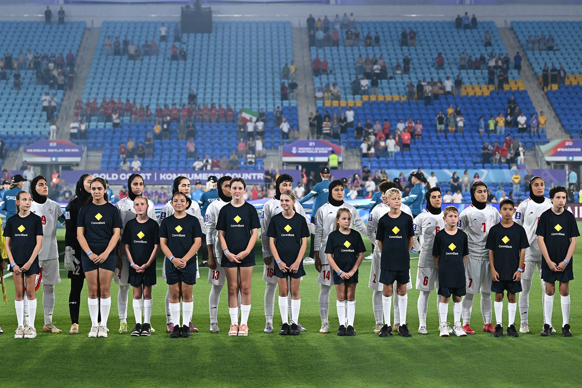 <i>Patrick Hamilton/AFP/Getty Images via CNN Newsource</i><br/>Police officers clear the road for a departing bus transporting members of the Iranian Women's Asia Cup football team to the airport outside the Royal Pines Resort on the Gold Coast on Tuesday