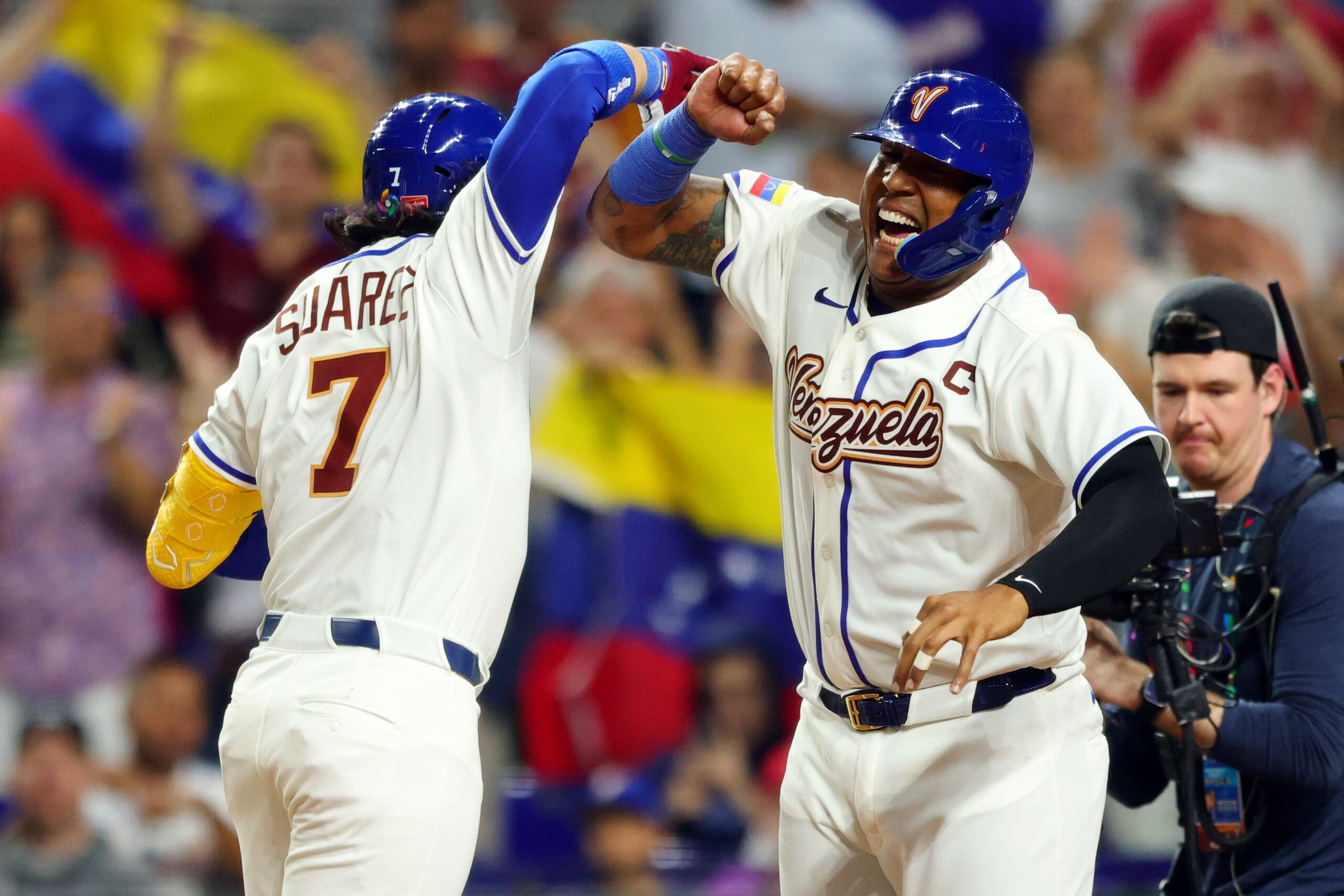<i>Kelly Gavin/MLB Photos/Getty Images via CNN Newsource</i><br/>Members of Team Venezuela stand during the national anthem before their game in Miami on Friday.