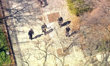 Law enforcement investigate Carl Schurz Park in New York on March 10.
