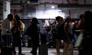 Travelers wait in line at a TSA checkpoint at Houston's William P. Hobby Airport on Monday.