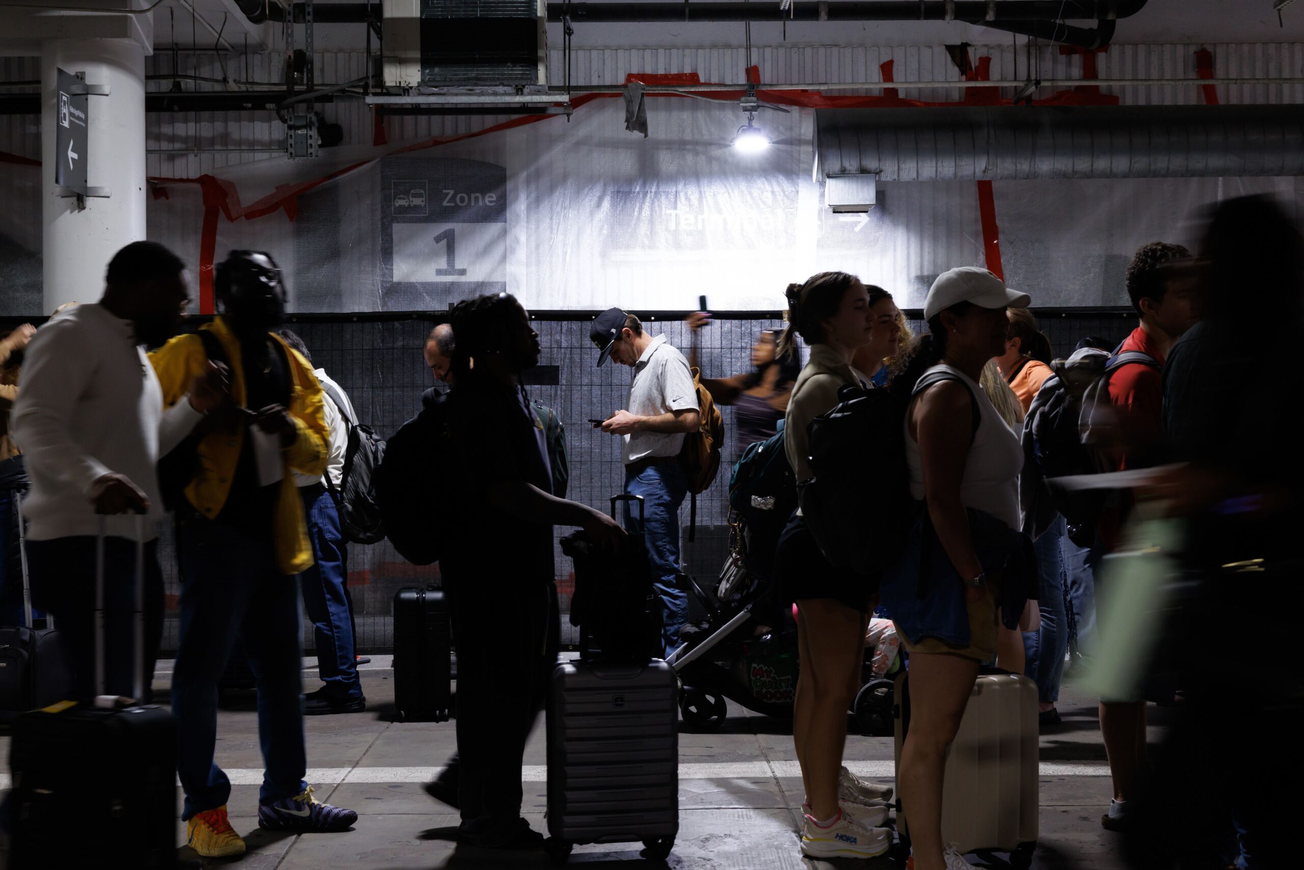 <i>Mark Felix/Bloomberg/Getty Images via CNN Newsource</i><br/>Travelers wait in line at a TSA checkpoint at Houston's William P. Hobby Airport on Monday.