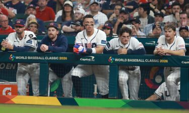 Members of Team USA look on from the dugout during the game against Italy on Tuesday night.