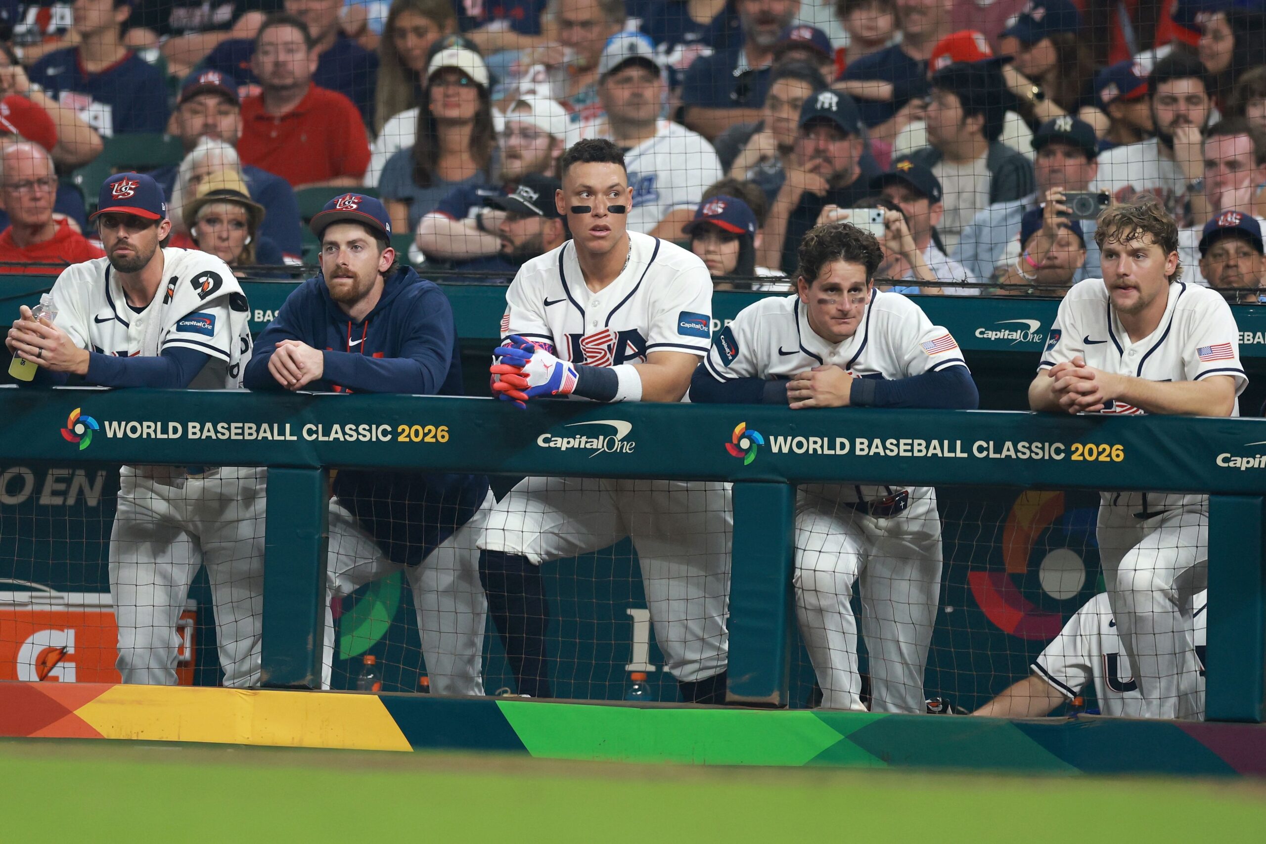 <i>Kenneth Richmond/Getty Images via CNN Newsource</i><br/>Members of Team USA look on from the dugout during the game against Italy on Tuesday night.
