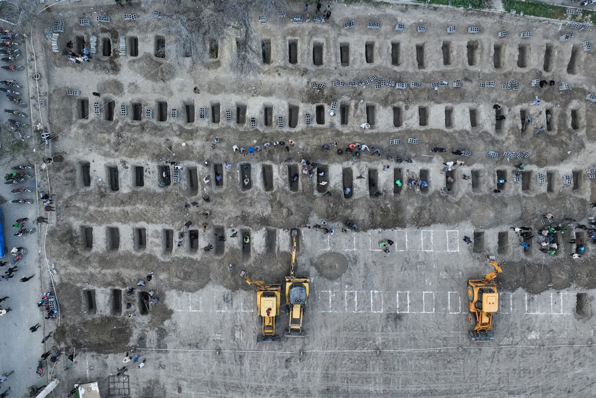 <i>Abbas Zakeri/Mehr News Agency/AP via CNN Newsource</i><br/>Rescue workers and residents search through the rubble in the aftermath of a strike on an elementary school in Minab
