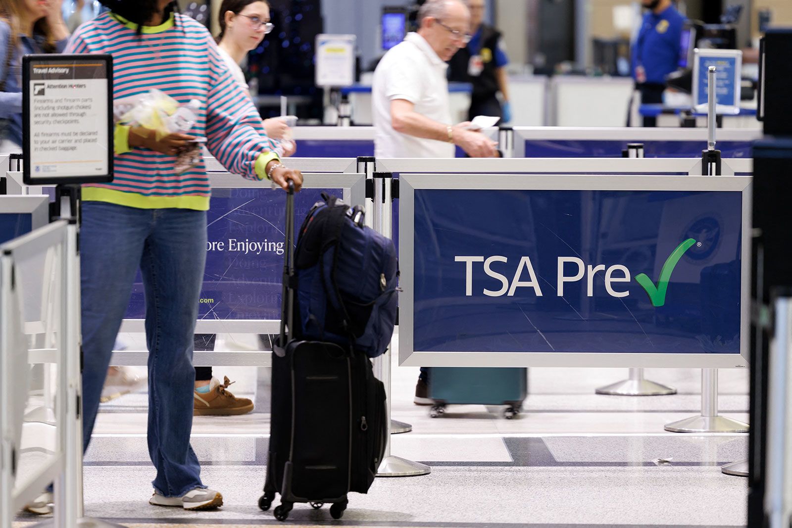 <i>Mark Felix/Bloomberg/Getty Images via CNN Newsource</i><br/>Travelers wait in line to get into a Transportation Security Administration checkpoint at William P. Hobby Airport in Houston