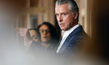 Governor Gavin Newsom speaks alongside local and state leaders during a press conference at BACS REGIS Center in Hayward