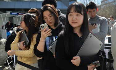 A robotic hand performs semiconductor chips packaging at Shandong NEM Semiconductor Co.