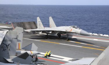 A J-15 Chinese fighter jet prepares to take off from the Shandong aircraft carrier during a combat readiness patrol on April 9