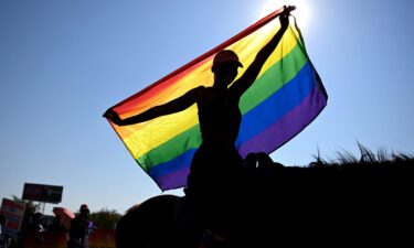 Anti‑LGBTQ supporters march through the streets during a protest calling for tougher action in Dakar