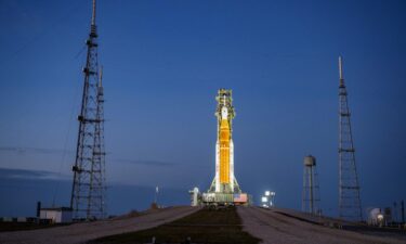 NASA’s Artemis II Space Launch System (SLS) rocket and Orion spacecraft are seen illuminated by lights at Launch Complex 39B