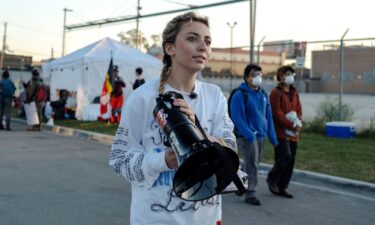 Democratic congressional candidate Kat Abughazaleh holds a megaphone outside of the Broadview ICE processing facility