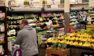 Food shoppers browse for groceries ahead of the Thanksgiving Day holiday at an Albertsons supermarket in Redmond