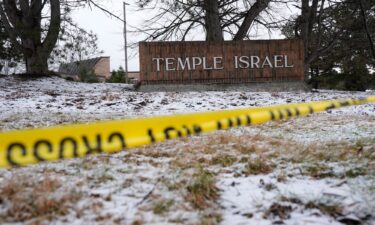 Police tape hangs outside the Temple Israel synagogue Friday.