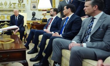 President Donald Trump is pictured with Secretary Pete Hegseth