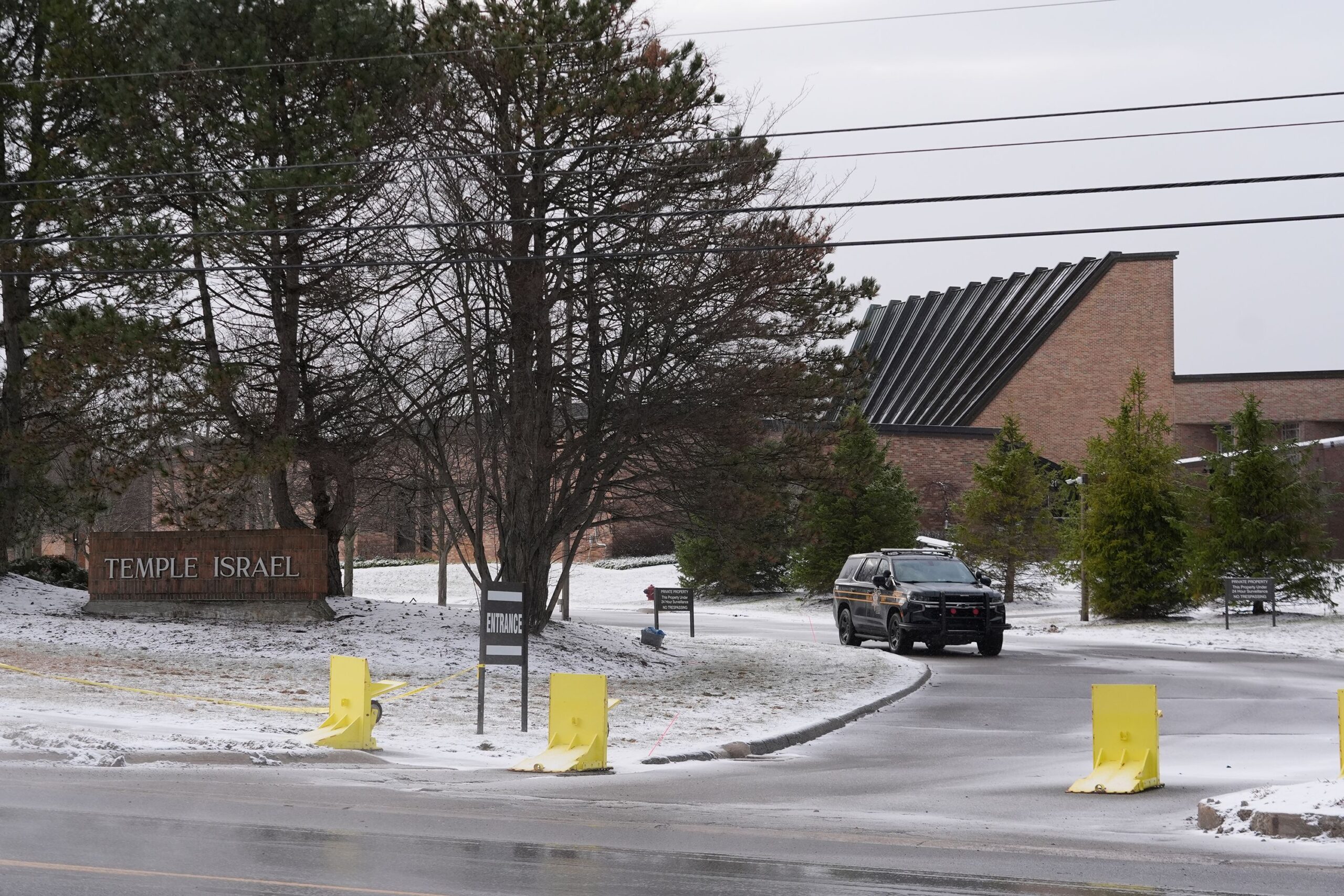 <i>Jeff Kowalsky/AFP/Getty Images via CNN Newsource</i><br/>Families leave after being reunited outside Temple Israel synagogue after an assailant rammed his truck into the building in West Bloomfield