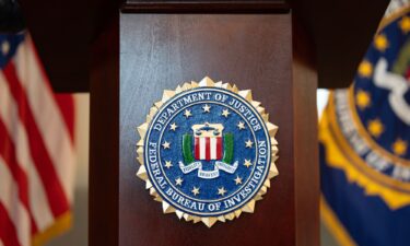 An FBI seal is displayed on a podium before a news conference at the field office in Portland