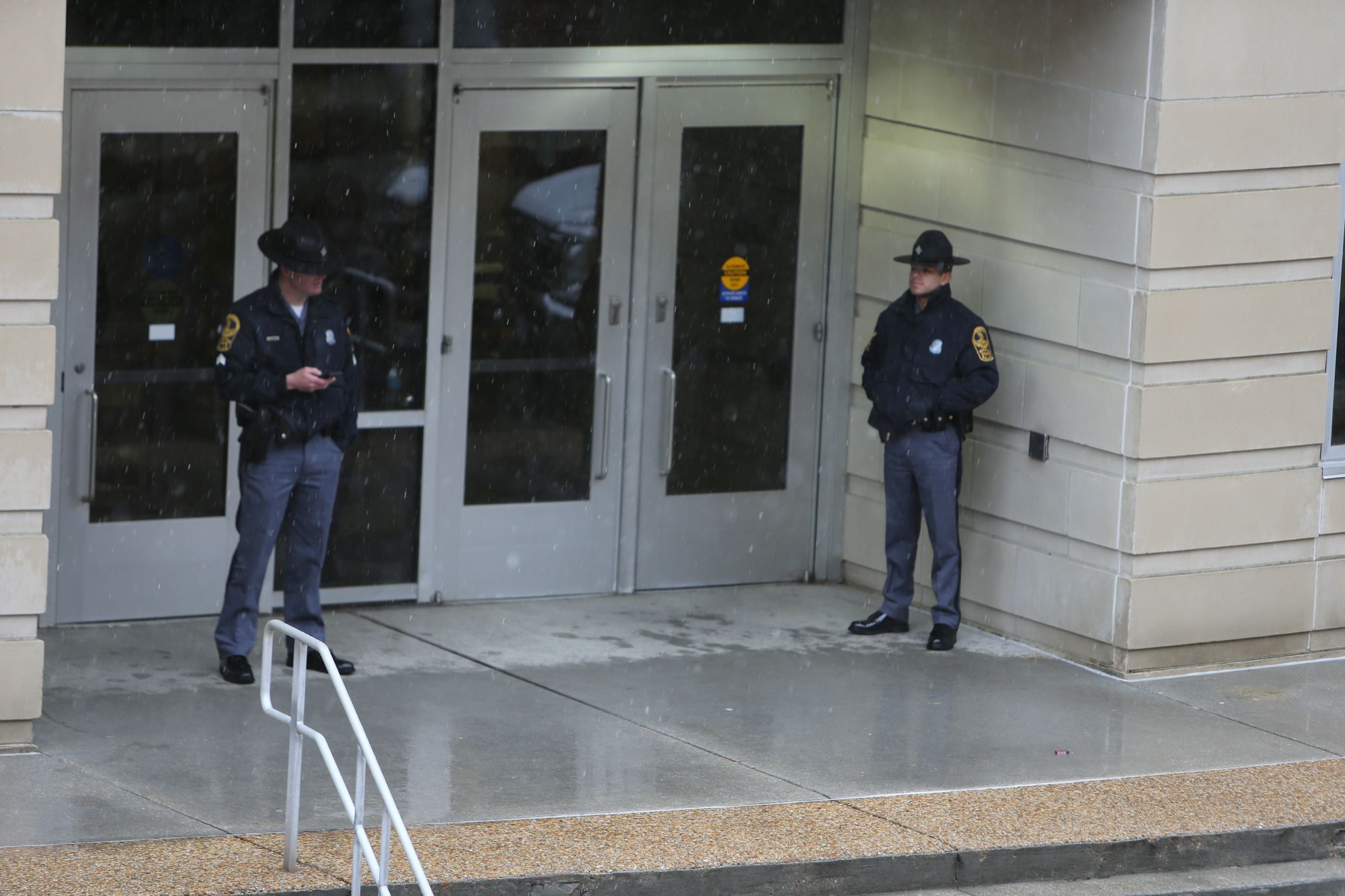 <i>John Clark/AP via CNN Newsource</i><br/>Police arrive outside Old Dominion University's campus after reports of an active shooter on March 12