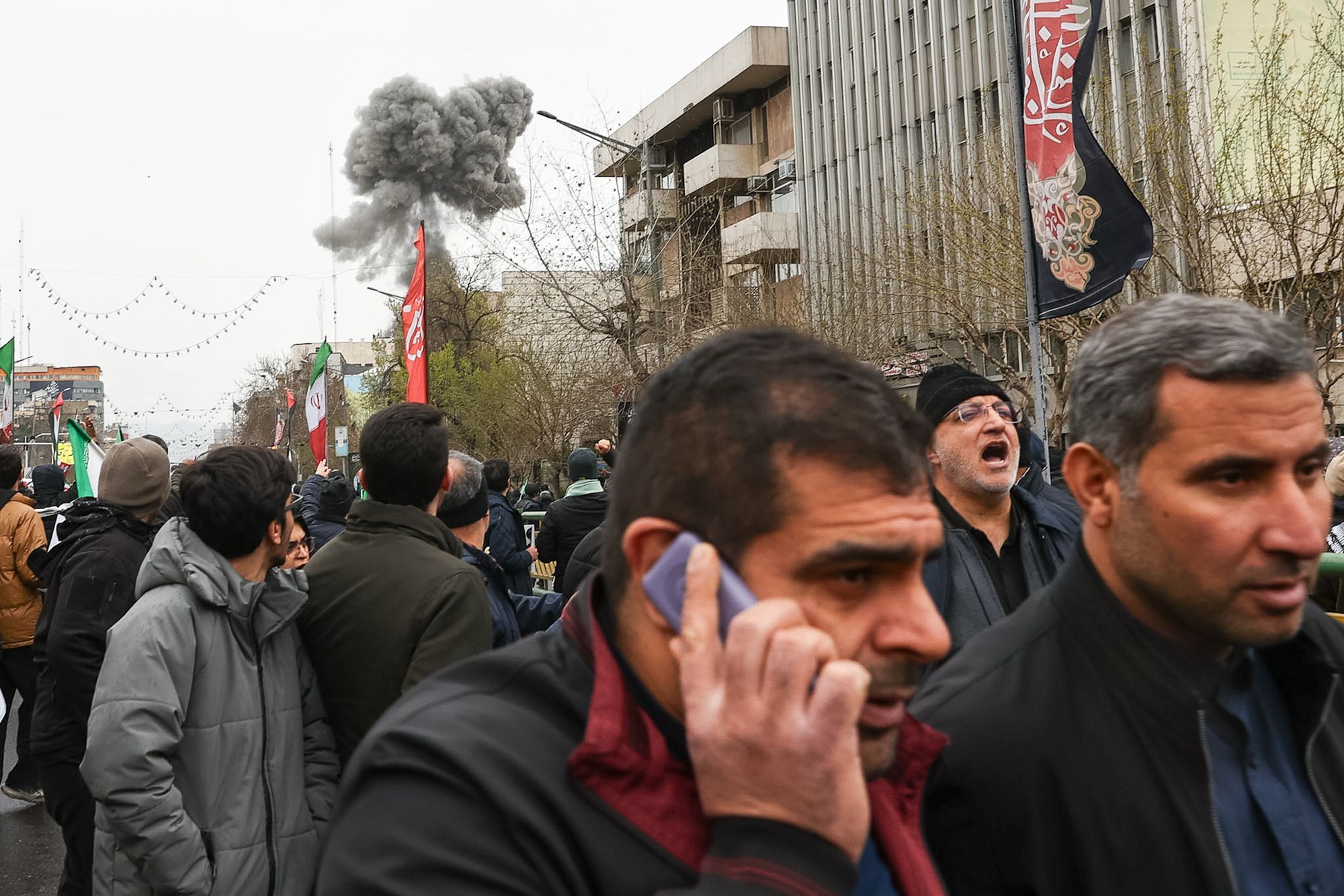 <i>Sajjad Safari/AP via CNN Newsource</i><br/>Rescue workers search for survivors in the rubble after a strike in southern Tehran