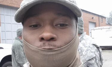 An officer carrying a large firearm heads onto Old Dominion University's campus in Norfolk