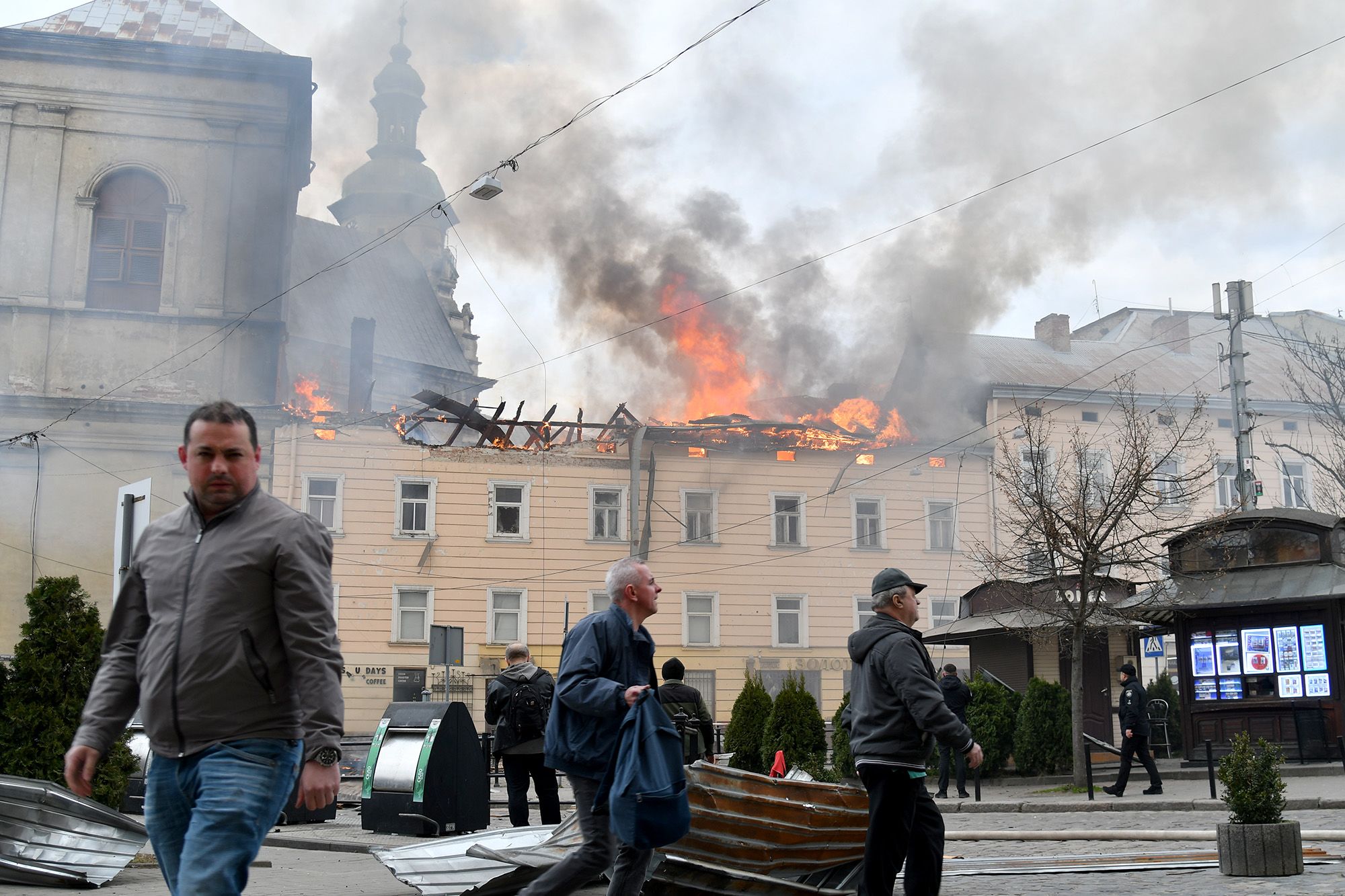 <i>Mykola Tys/AP via CNN Newsource</i><br/>Fire and smoke rise above the city center following a Russian drone attack in Lviv