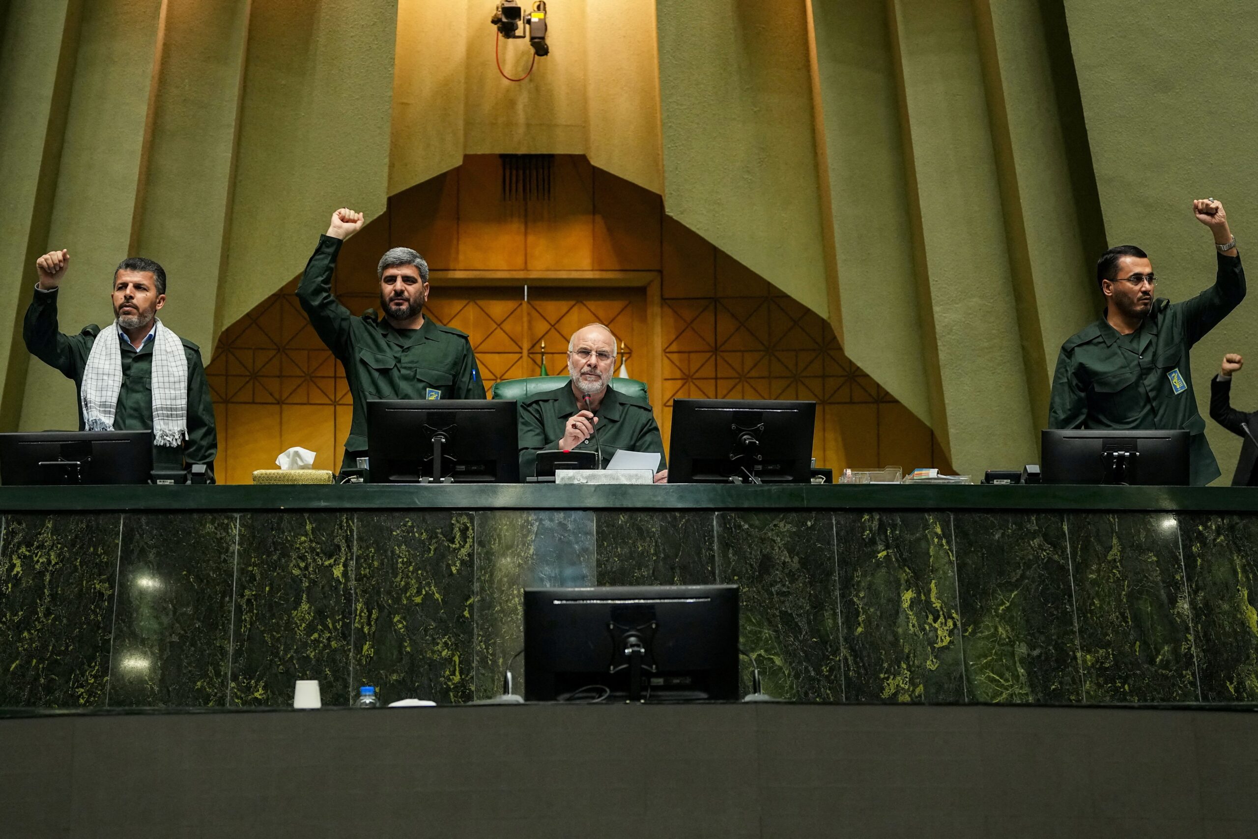 <i>Hamed Malekpour/WANA/Reuters via CNN Newsource</i><br/>Iranian Parliament Speaker Mohammad Bagher Ghalibaf looks on as parliamentarians chant in support of the Islamic Revolutionary Guard Corps (IRGC) in Tehran on February 1.