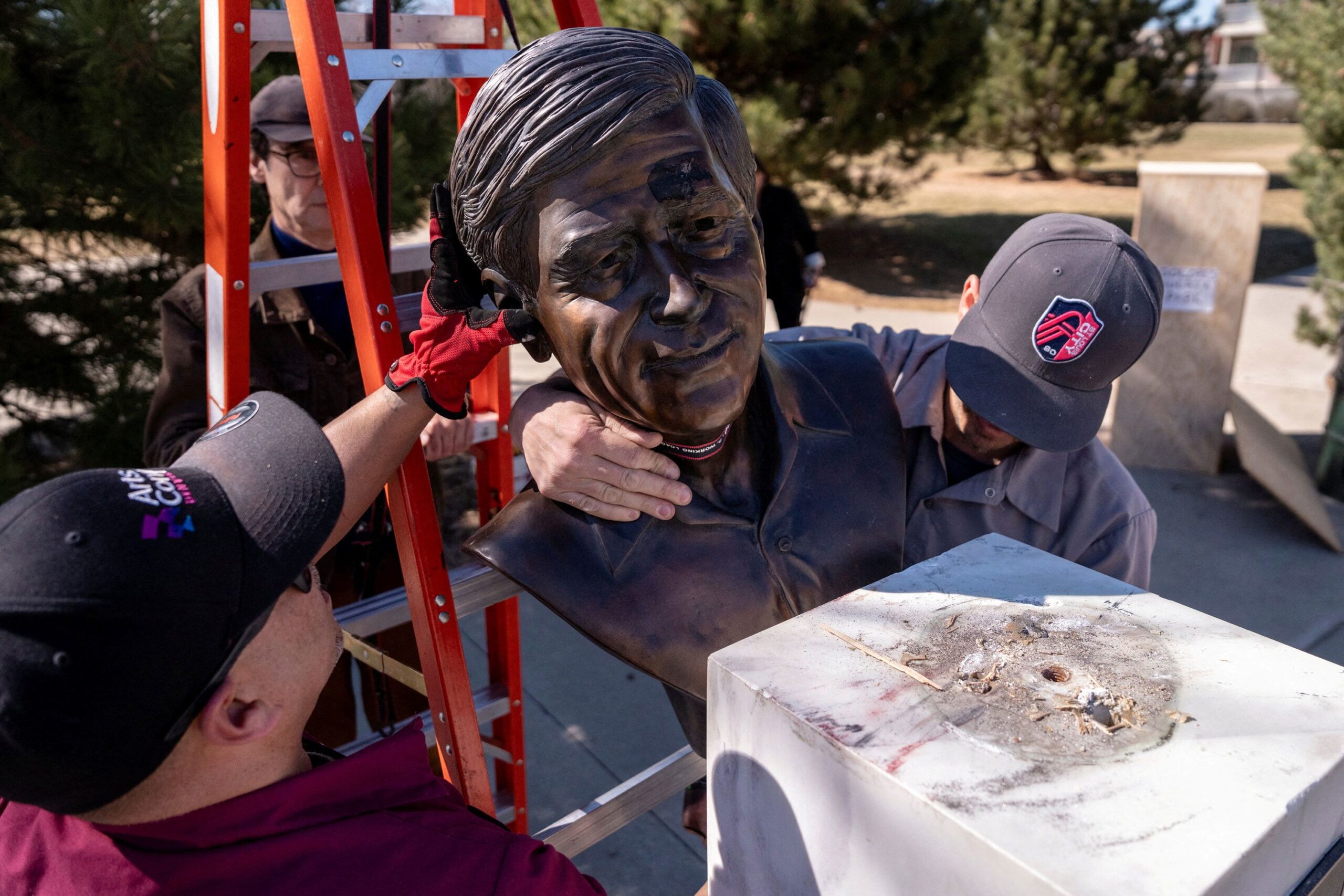 <i>Cheney Orr/Reuters via CNN Newsource</i><br/>Facilities workers remove a bust of Cesar Chavez in Denver on March 19. Mayor Mike Johnston said the city would remove Chavez’s name from a park in the Berkeley neighborhood