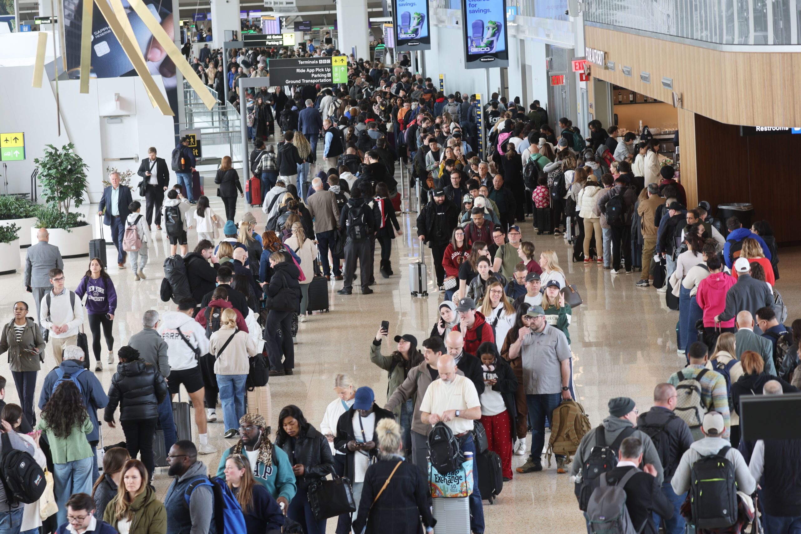 <i>Spencer Platt/Getty Images via CNN Newsource</i><br/>Security lines wind through LaGuardia Airport on Wednesday. The airport is one of many that have been crippled by TSA worker shortages.